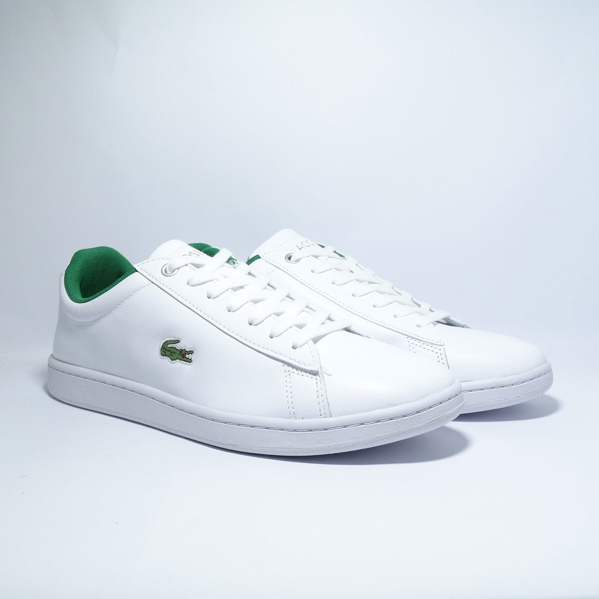 ZAPATILLAS DE ESTILO CASUAL DE BLANCO PREDOMINANTE Y DETALLES EN VERDE - Imagen 2